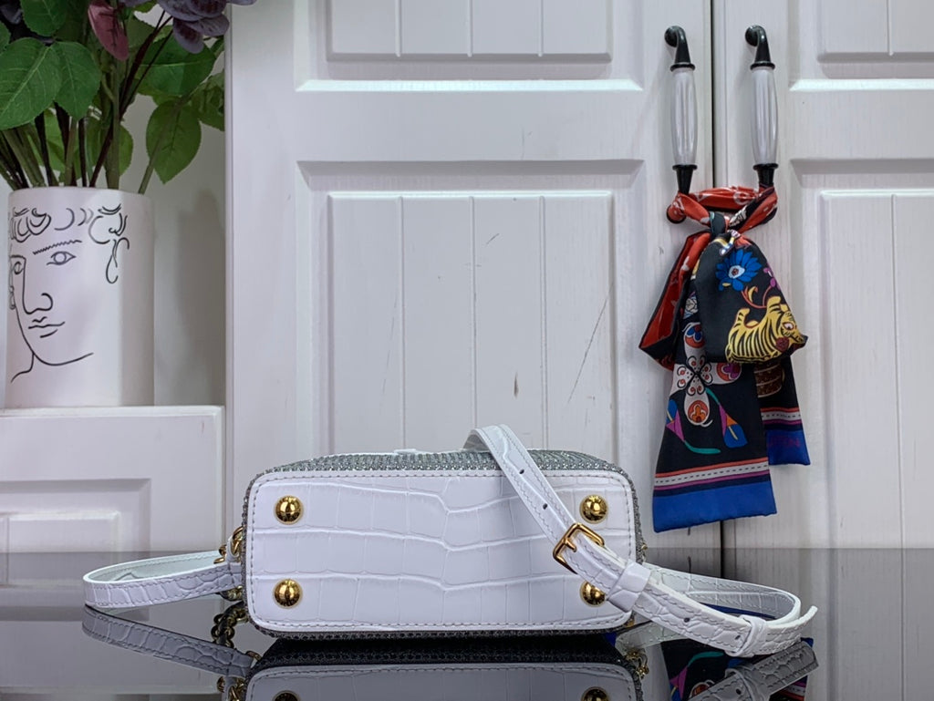 White handbag with gold studs, front flap and crossbody strap