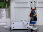 White handbag with gold studs, front flap and crossbody strap