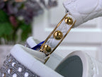 White handbag clasp and hinge with gold hardware, leather tab detail