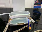 Open white handbag showing light lining and gold clasp at top