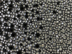 Silver rhinestone-studded exterior texture on a black mini bag