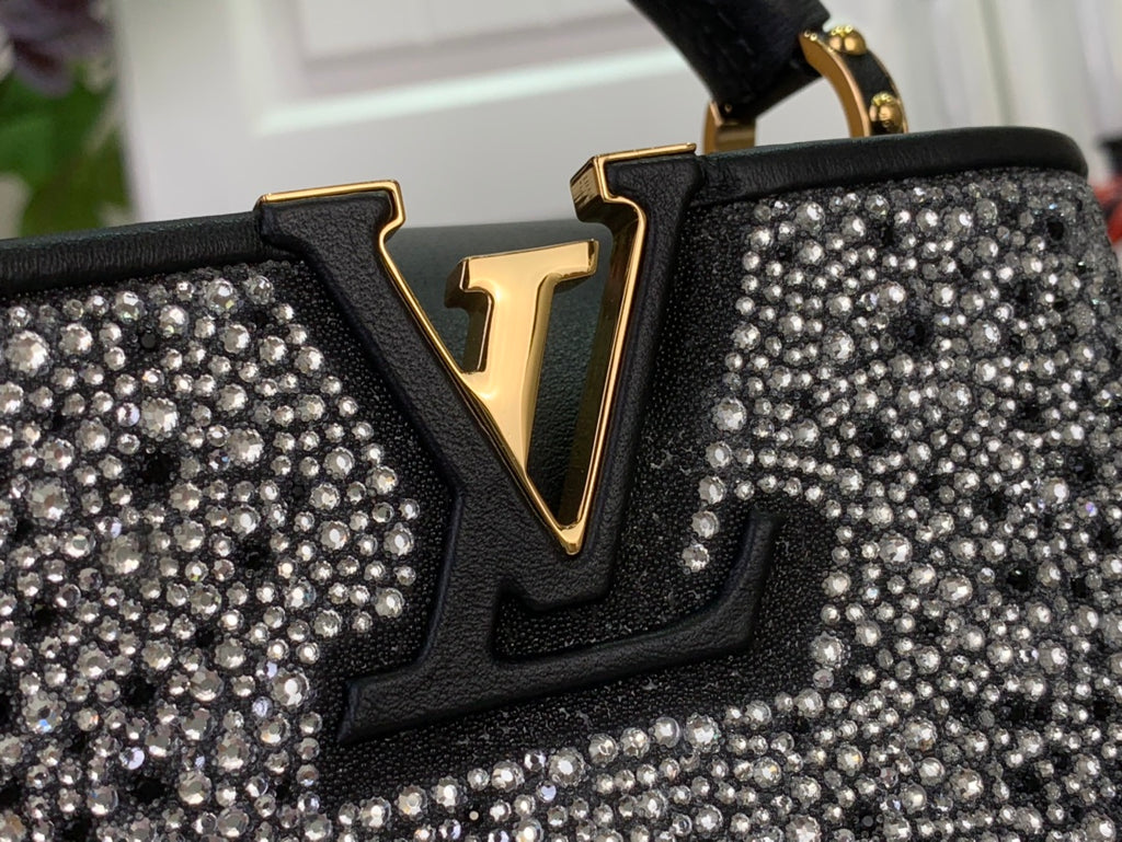 LV V emblem on black leather with dense silver rhinestone stud detailing