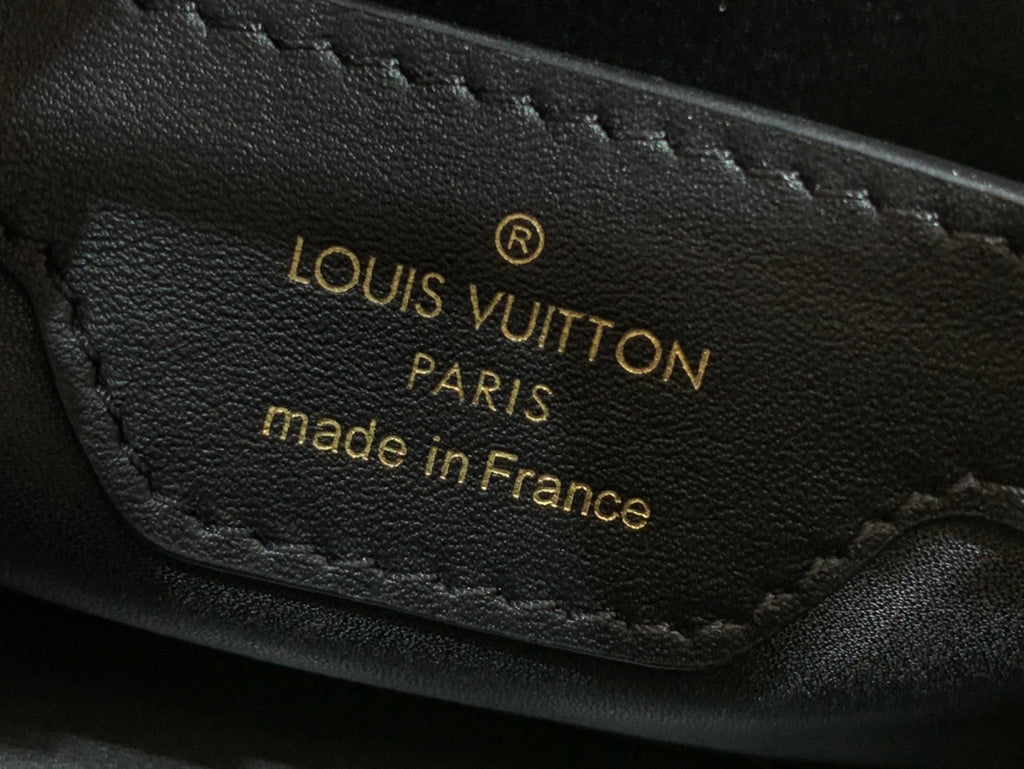 Black leather interior label with gold text: LOUIS VUITTON PARIS made in France