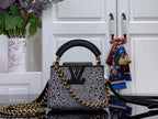 Louis Vuitton mini bag in black with silver studded pattern and gold chain strap