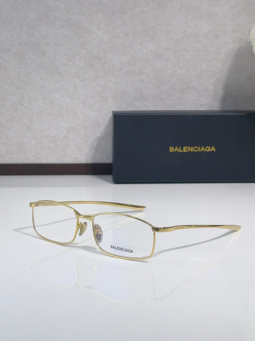 Balenciaga eyeglasses with gold-tone frame and clear lenses