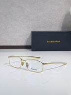 Balenciaga eyeglasses with gold-tone frame and clear lenses