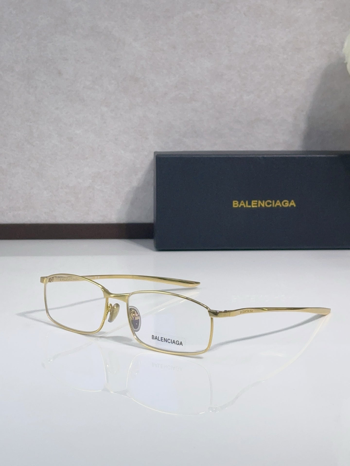 Balenciaga eyeglasses with gold-tone frame and clear lenses