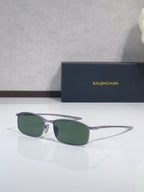 Balenciaga sunglasses with silver-tone frame and green-tinted lenses