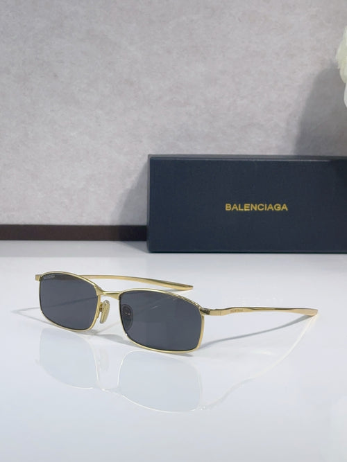 Balenciaga sunglasses with gold-tone frame and dark square lenses
