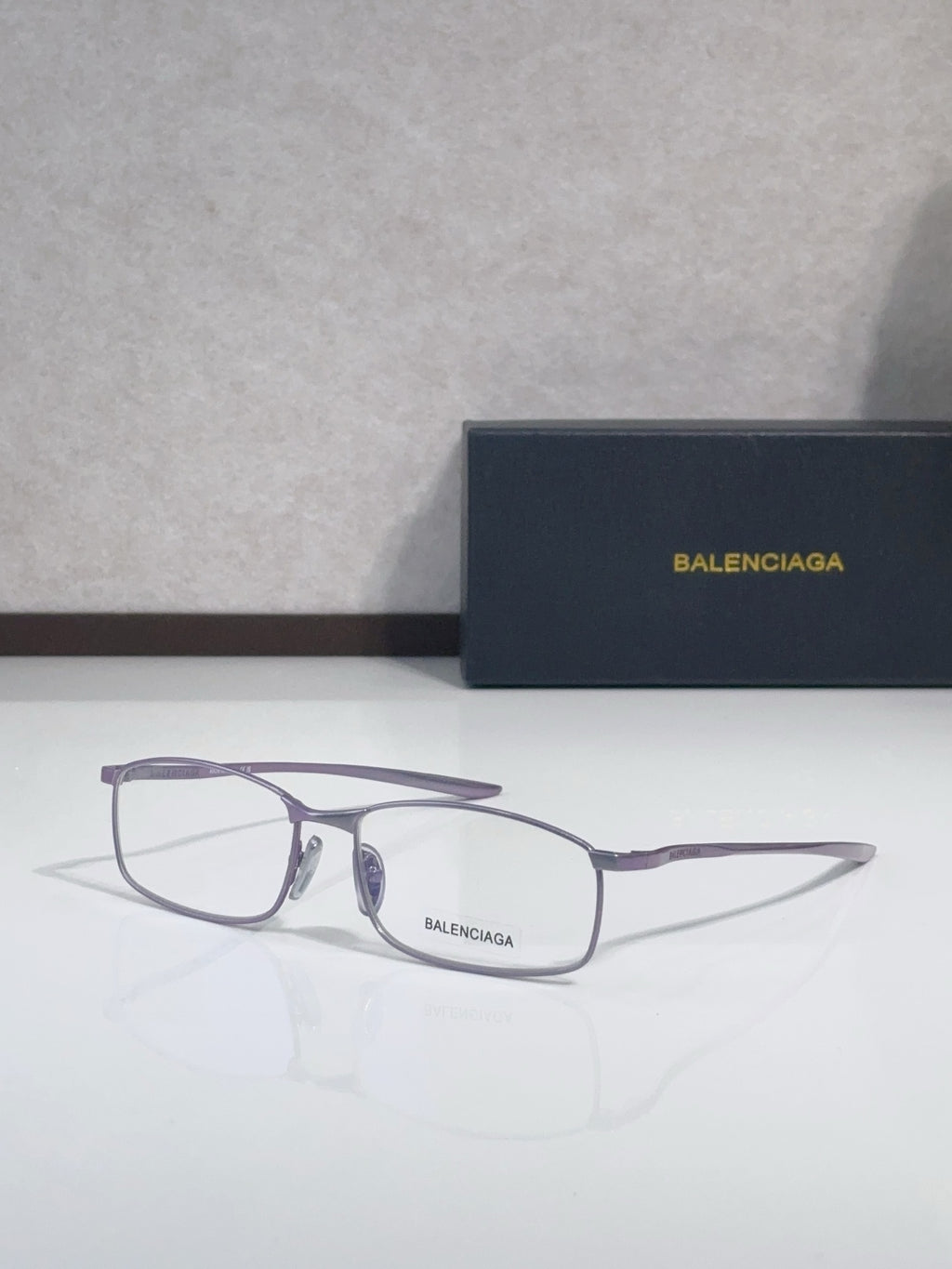 Balenciaga eyeglasses with purple-tone frame and clear lenses