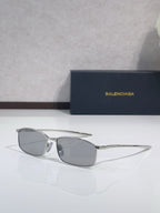 Balenciaga sunglasses with silver-tone frame and gray oval lenses