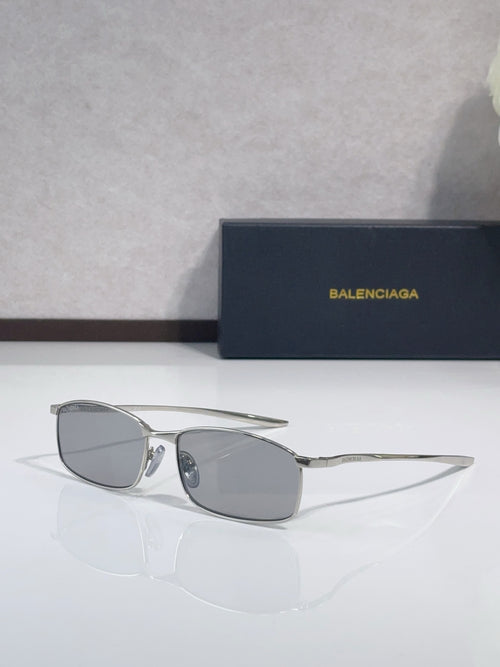 Balenciaga sunglasses with silver-tone frame and gray oval lenses