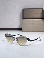Bvlgari sunglasses with black frames and muted yellow gradient lenses, cat-eye style