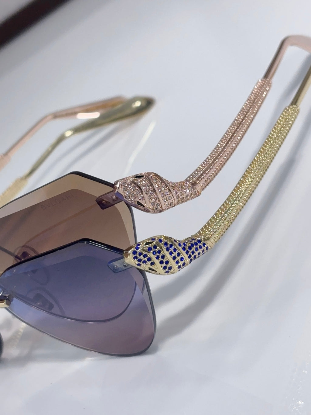 Bvlgari sunglasses with rhinestone temples and blue/purple gradient lenses, cat-eye style
