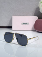 Gold-tone sunglasses with dark navy lenses and minimal metal bridge detailing