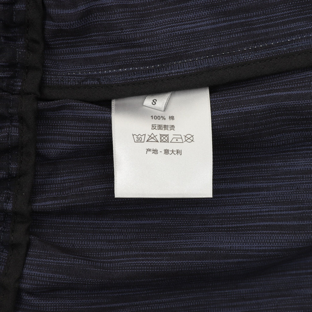 Size S care label on navy jogger pants