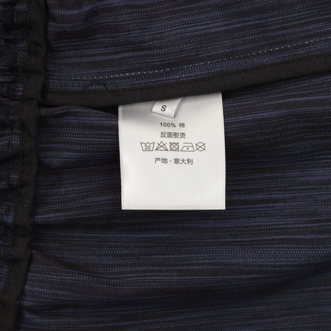 Size S care label on navy jogger pants
