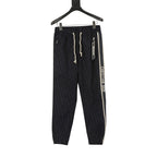 Navy jogger pants, elastic waist, white drawstrings, Christian Dior side stripe