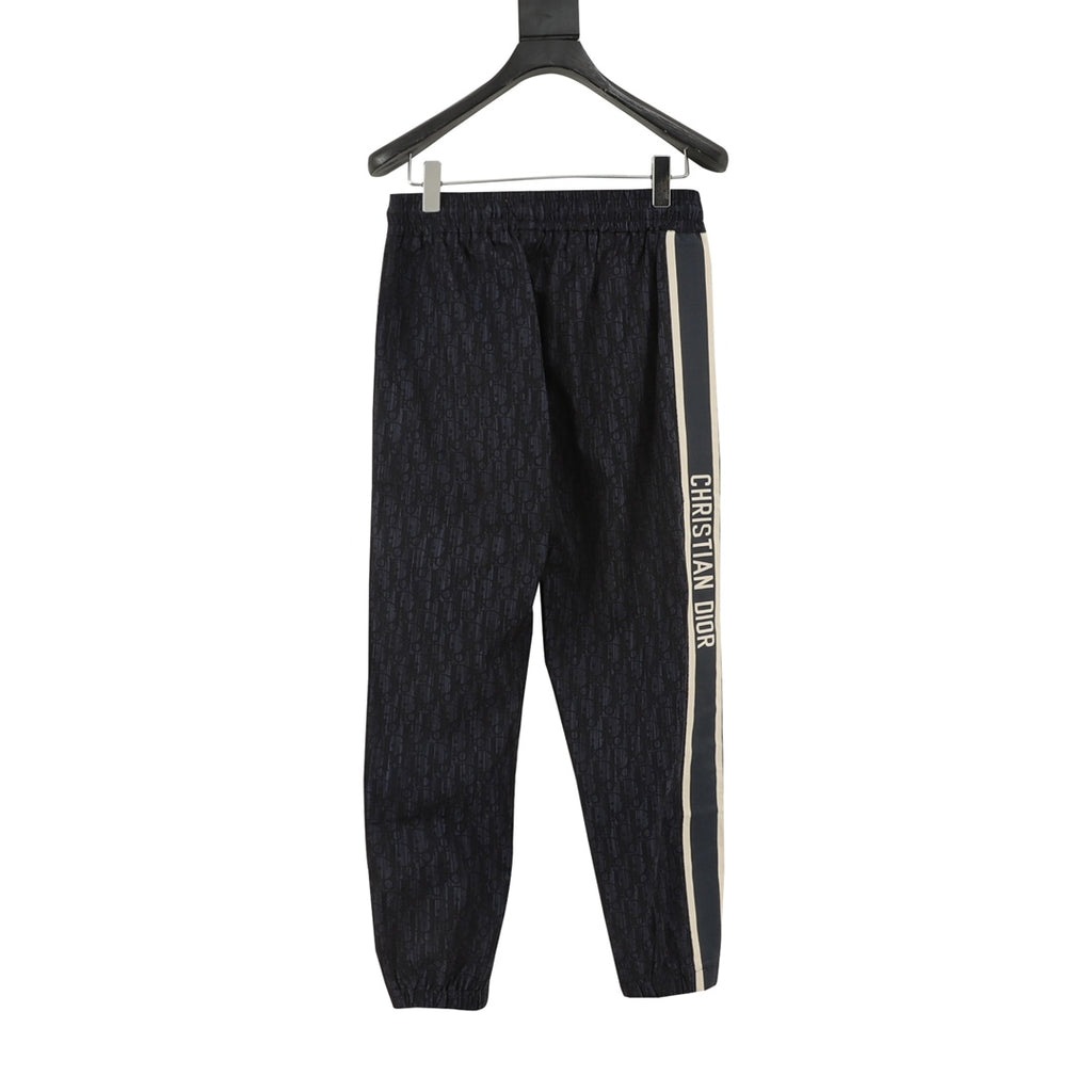 Navy jogger pants with elastic waist and side stripe with Christian Dior text