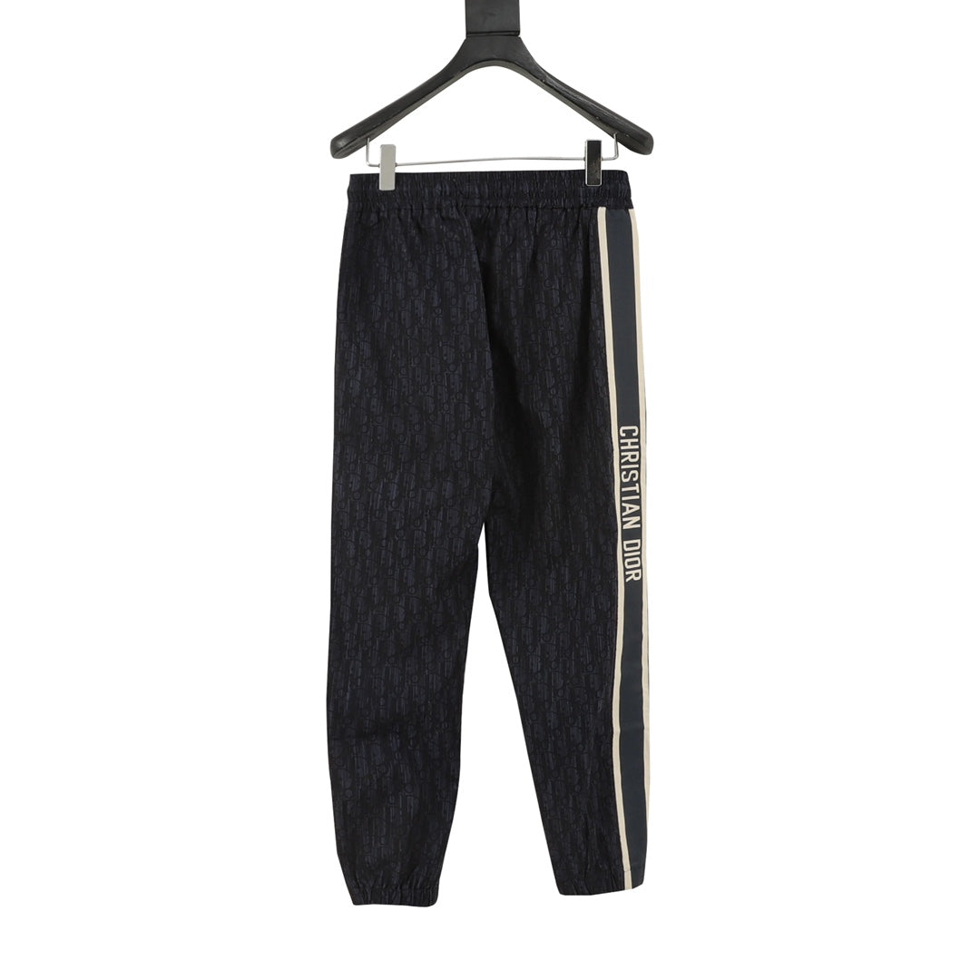Navy jogger pants with elastic waist and side stripe with Christian Dior text