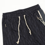 Navy printed jogger pants, elastic waist, white drawstring cords