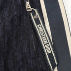 Navy jogger pants with Christian Dior logo zipper trim and side stripe