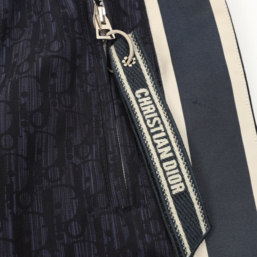 Navy jogger pants with Christian Dior logo zipper trim and side stripe