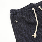 Navy printed jogger pants, elastic waist, white drawstring cords