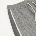 Grey Dior logo track pants with front seams and zip pocket detail