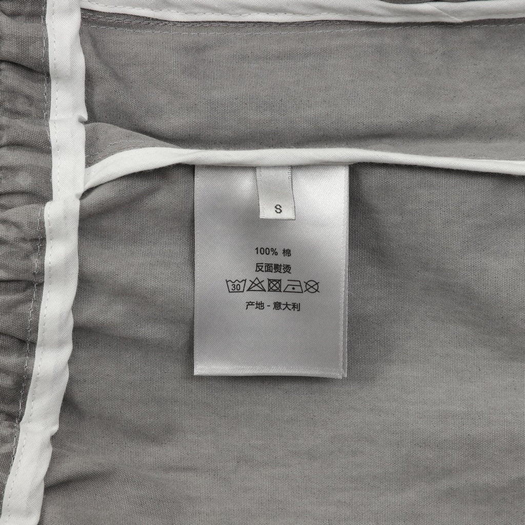 Inner care label on grey Dior pants with size S and 100% fabric
