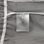 Inner care label on grey Dior pants with size S and 100% fabric
