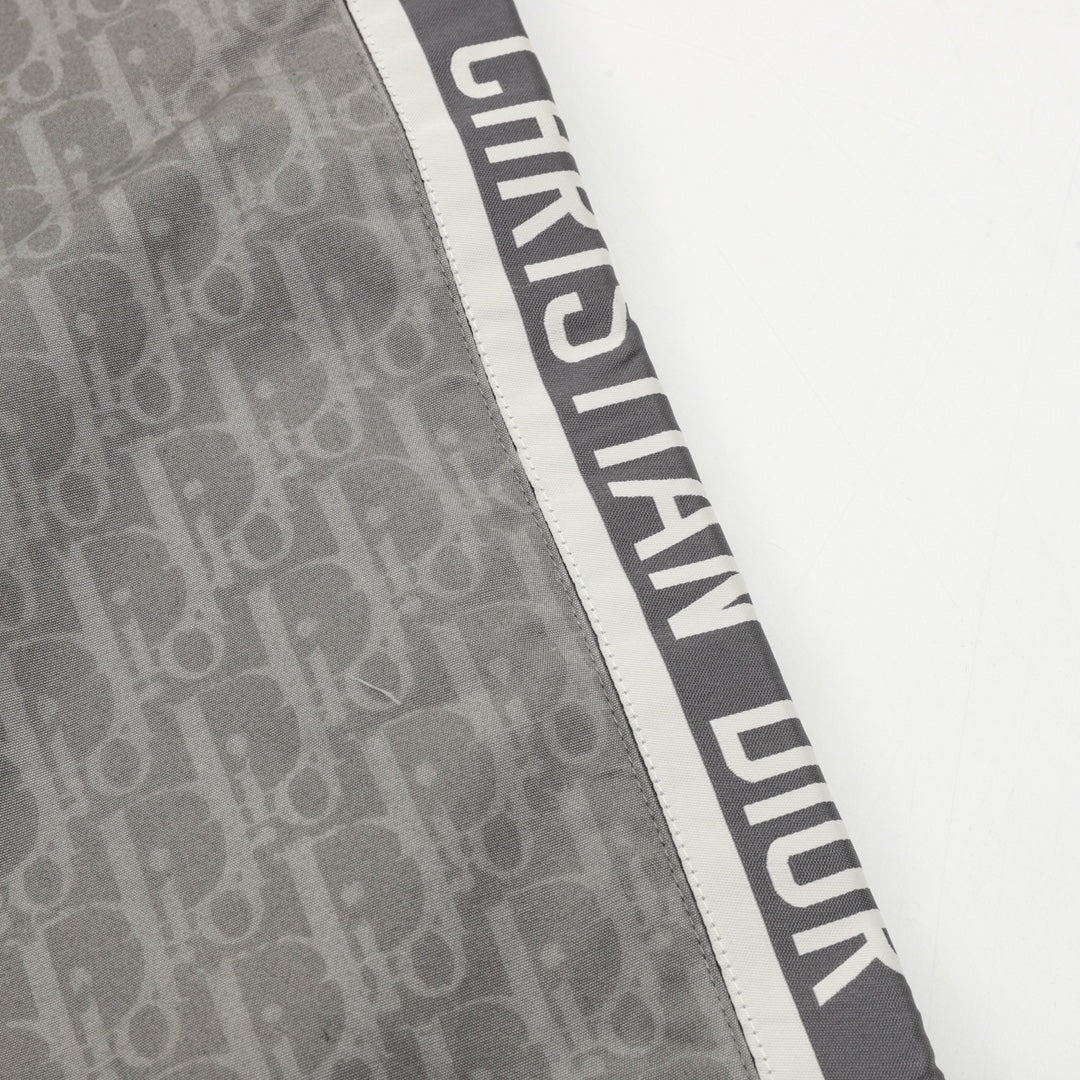 Dior pants side stripe with bold vertical lettering on dark gray fabric