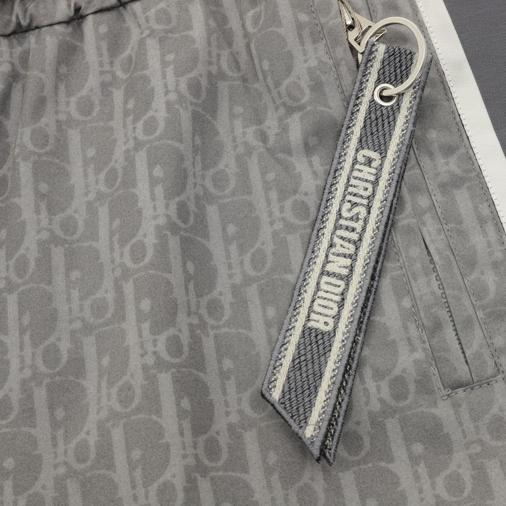 Grey Dior logo pants with side zip pocket and hanging logo tag