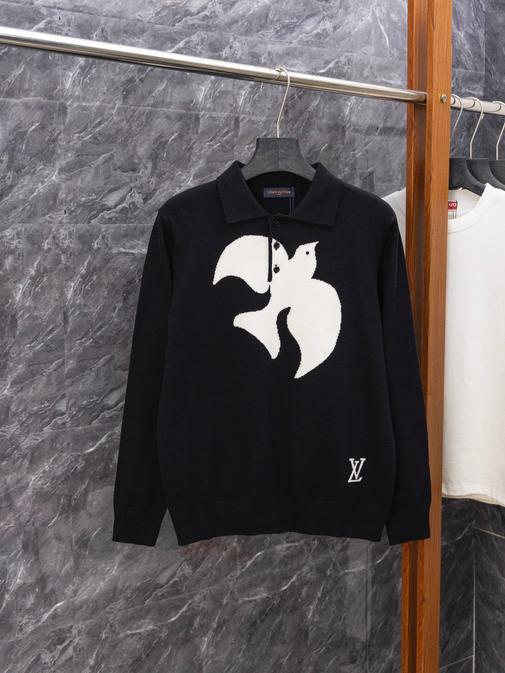 Black long-sleeve sweater with white graphic print and ribbed polo collar