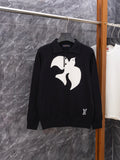 Black long-sleeve sweater with white graphic print and ribbed polo collar