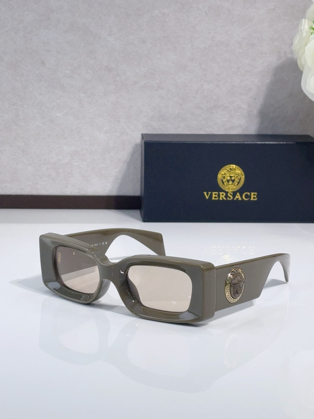 Versace cat-eye sunglasses, olive-gray frame with clear lenses and logo medallion