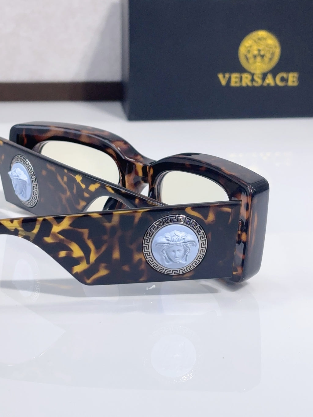 Versace cat-eye sunglasses, tortoiseshell frame with gold-pattern temple and medallion