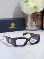Versace cat-eye sunglasses, tortoiseshell frame with blue-tinted lenses and logo medallion