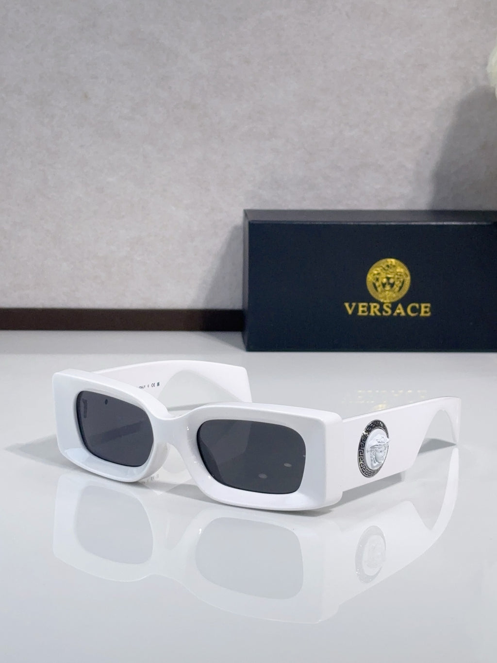 Versace cat-eye sunglasses, white frame with dark lenses and logo medallion