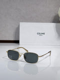 Oval sunglasses with gold-tone frame and dark blue lenses, logo on temples