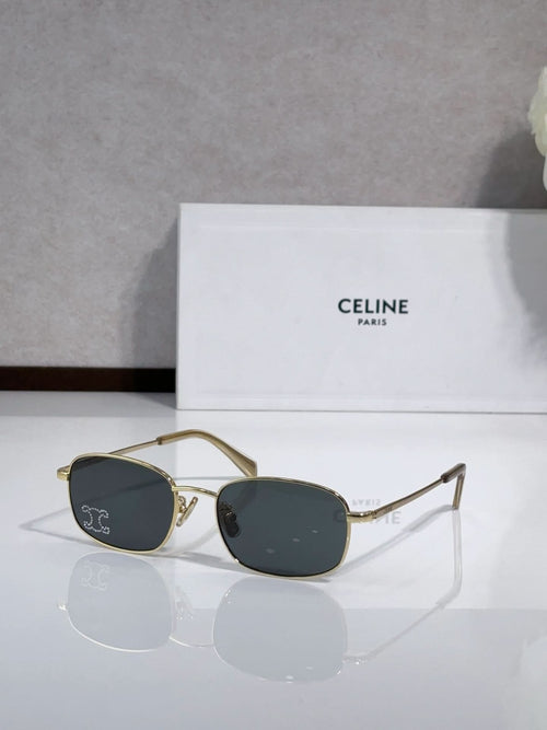Oval sunglasses with gold-tone frame and dark blue lenses, logo on temples