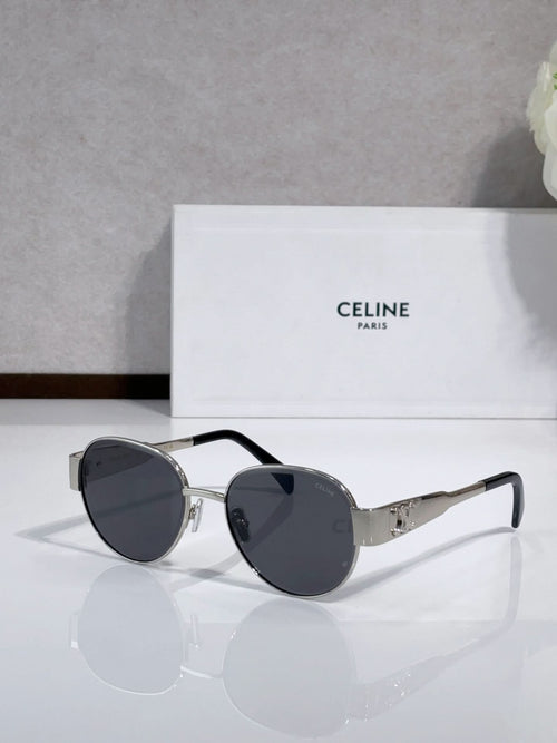 Round sunglasses with dark frame and tinted lenses, gold-tone hinges, slim metal arms