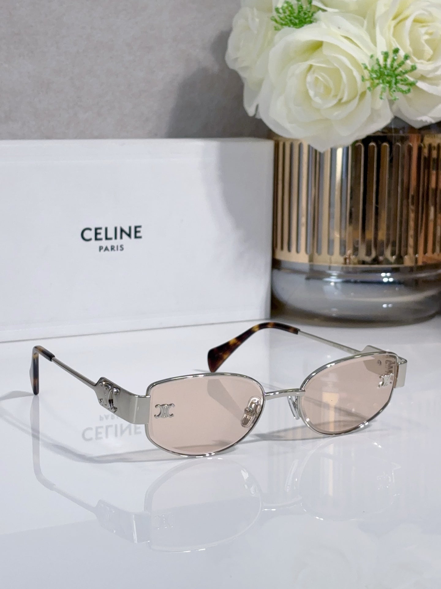 Celine sunglasses with light beige lenses, silver frame, tortoise temple tips