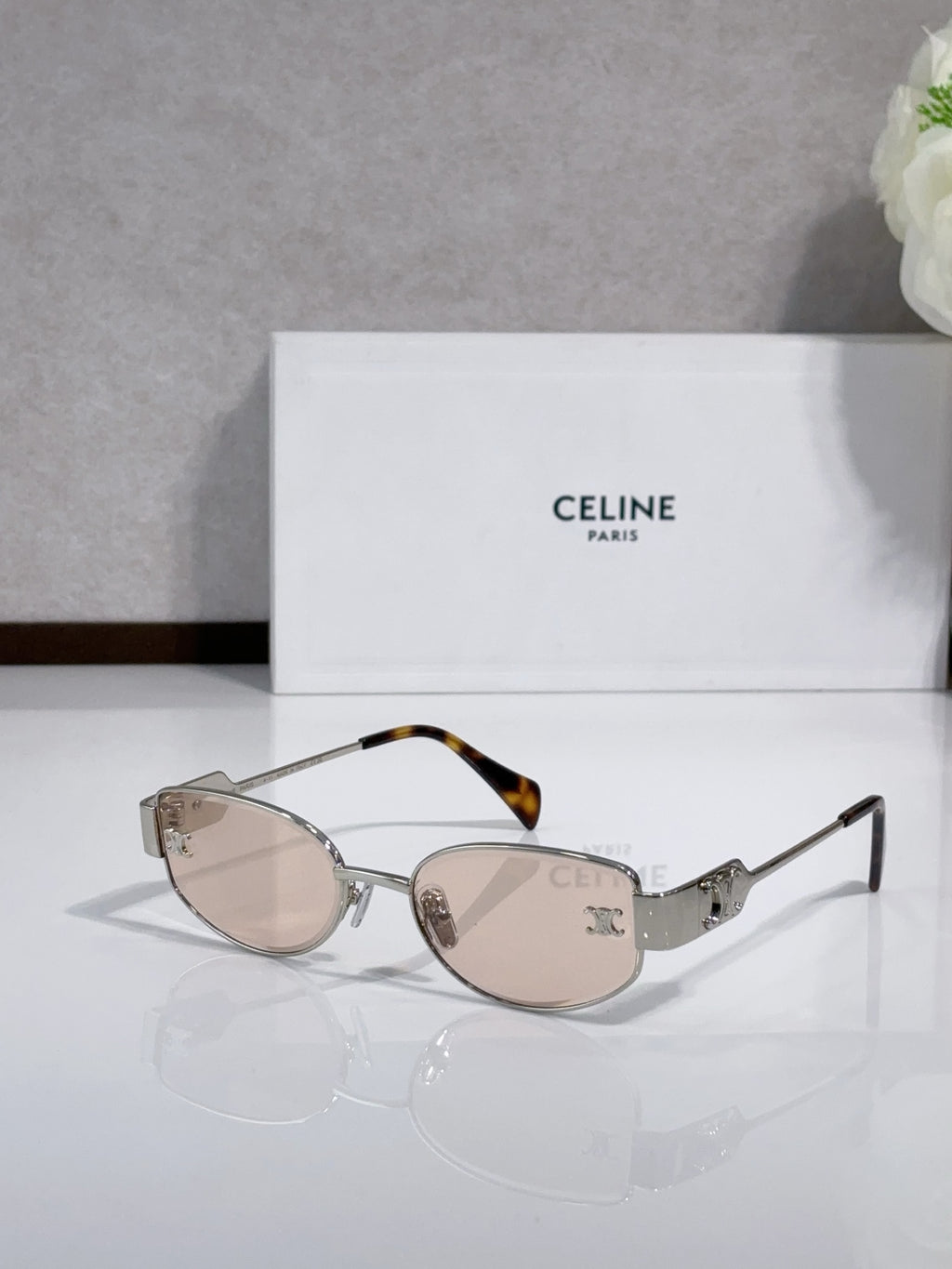 Celine sunglasses with rose-tinted lenses, silver frame, tortoise accents