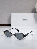 Celine sunglasses with dark blue lenses, black arms, gold-tone frame