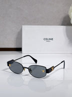 Celine sunglasses with dark blue lenses, black arms, gold-tone frame
