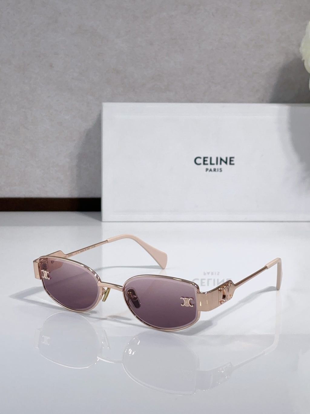 Celine sunglasses with purple lenses, pale pink arms, gold-tone frame