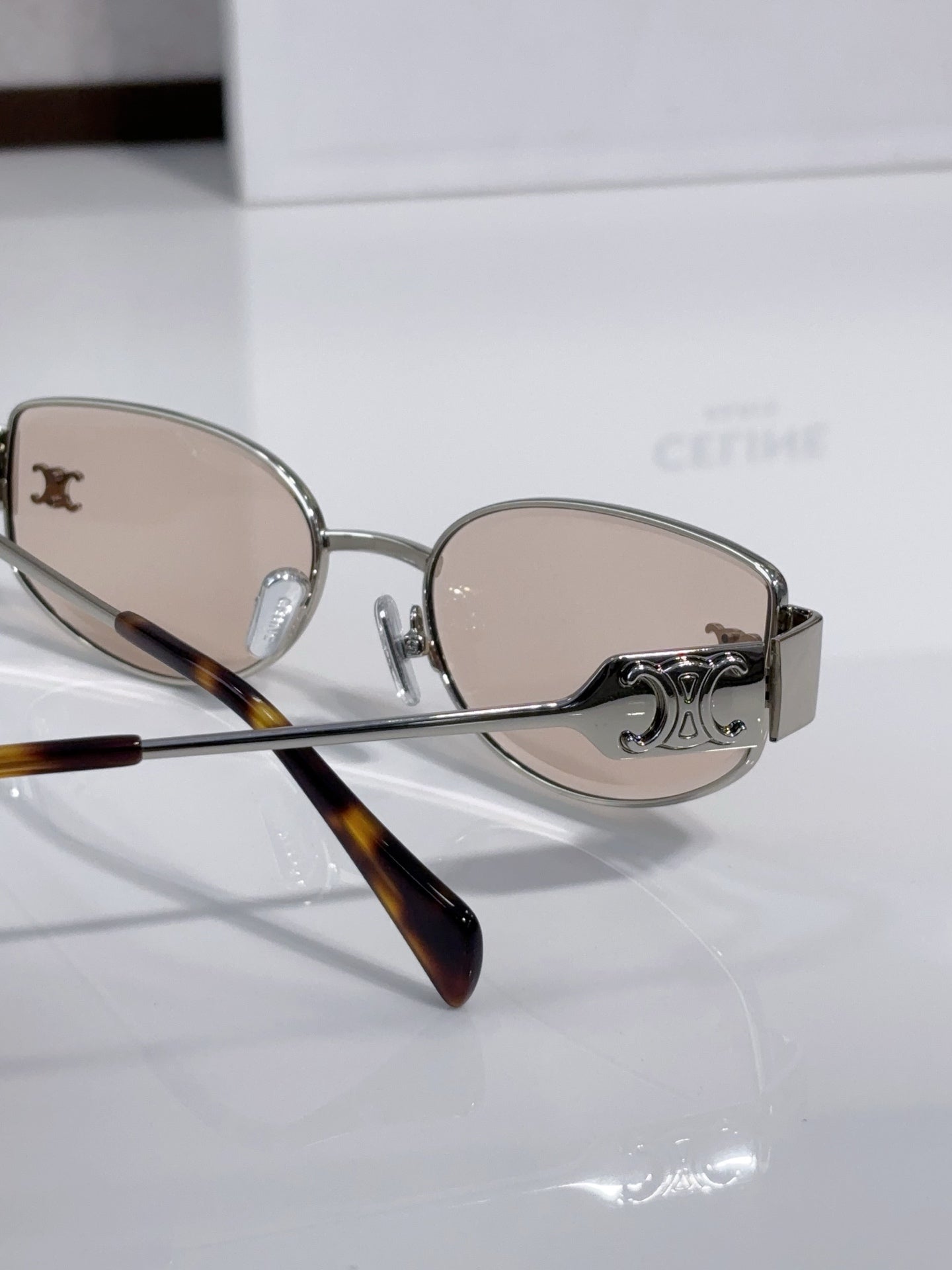 Celine sunglasses side view with beige lenses, silver frame, tortoise temple tips