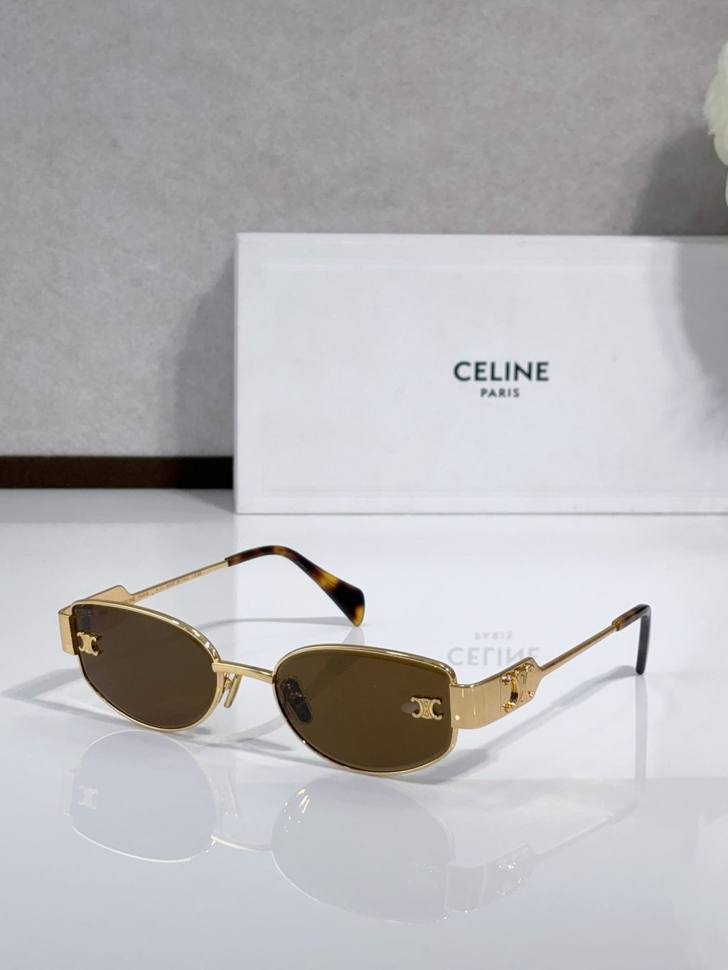 Celine sunglasses with dark olive lenses, tortoise arms, gold-tone frame