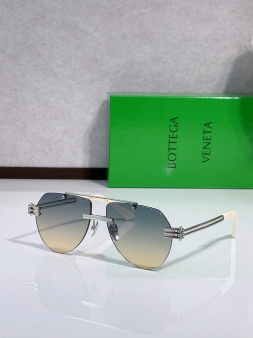 Bottega Veneta sunglasses with silver metal frame and smoky gray tinted lenses